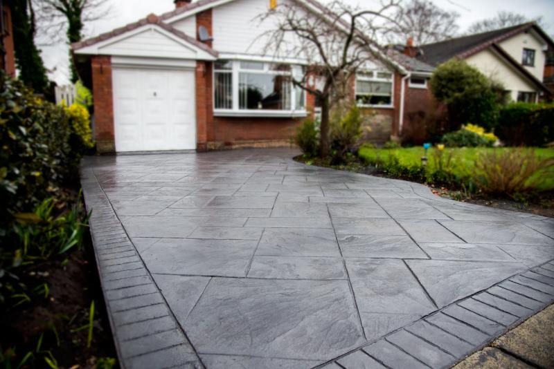 Completed pattern imprinted concrete driveway resealing project